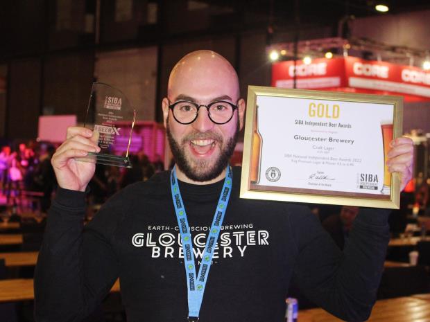 Gloucester Brewery's head brewer, Pietro Lovato, shows off the business's win at the SIBA BeerX 2022.