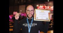 Gloucester Brewery's head brewer, Pietro Lovato, shows off the business's win at the SIBA BeerX 2022.