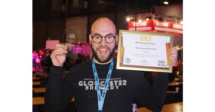 Gloucester Brewery's head brewer, Pietro Lovato, shows off the business's win at the SIBA BeerX 2022.
