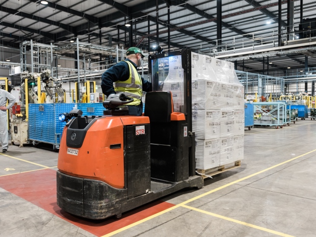 Staff at the Brockworth G-TEKT Europe Manufacturing loading vans with ventilators destined to help Covid-19 patients in India.
