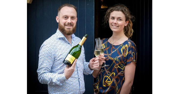 Tom Holland and Alice Westcombe toast the forthcoming opening of new restaurant Henrys, in Gosditch Street, Cirencester.