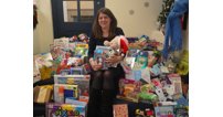 Laura Wilson of King's School with the collection of toys collected for the Mission Christmas charity.