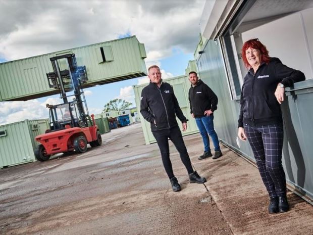 Jane Barton and Andy Ryan, of Newspace Containers, and Ryan Mountfield, of GMP.