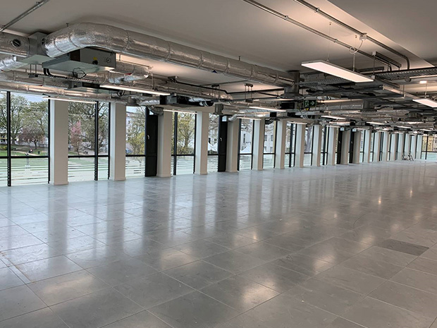 The Quadrangles first new office tenant will occupy almost 9,000 square feet of contemporary work space on the iconic buildings second floor.