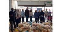 Hash Norat, far left, with just some of the volunteers and a fraction of the food parcels they deliver for Gloucester Feed the Hungry.