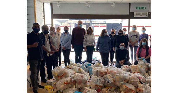 Hash Norat, far left, with just some of the volunteers and a fraction of the food parcels they deliver for Gloucester Feed the Hungry.