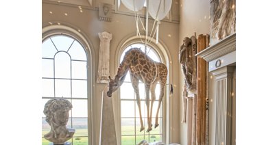 Aynhoe Park's flying giraffe is one of the most unique lots going under the hammer.