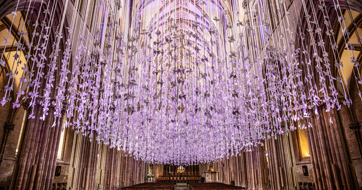 Thousands of illuminated paper doves go on display at Tewkesbury Abbey