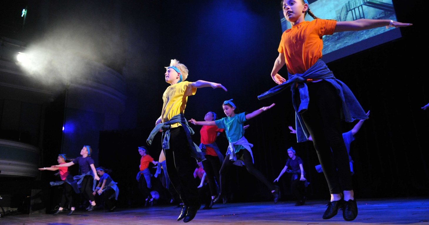 Children from Stagecoach Performing Arts performing on stage