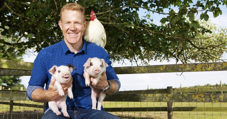 Adam Henson with Gloucestershire Old Spot piglets