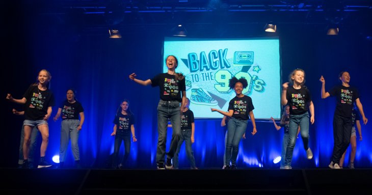 Children performing on stage with Stagecoach Performing Arts Cirencester