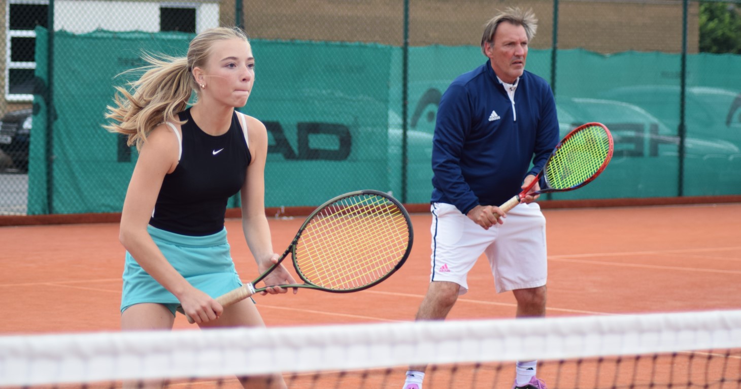 Eva age 13, playing tennis at East Glos Club in Cheltenham with coach Pete Russell