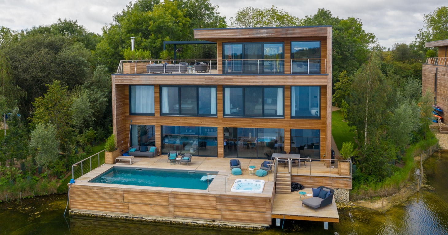 A designer lake house with panoramic views of the Cotswolds