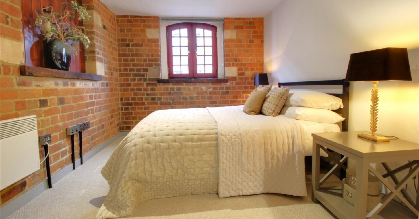 The spacious second bedroom is ideal for entertaining guests.
