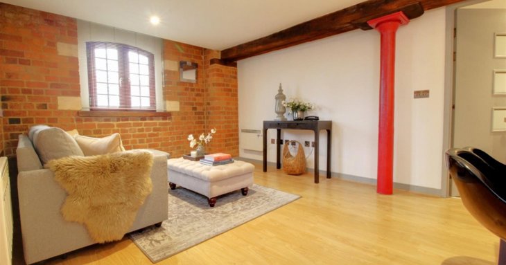 The open-plan living area has lots of characterful period features, as well as a Juliet balcony.