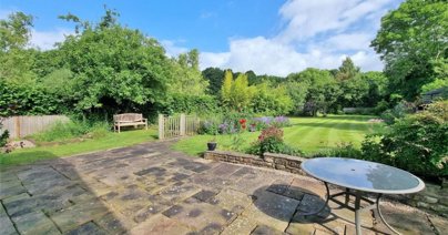 Sitting within just under an acre of land, the property boasts a spectacular garden with its own pond and orchard.